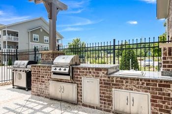 Gas grilling station and summer kitchen with pergola